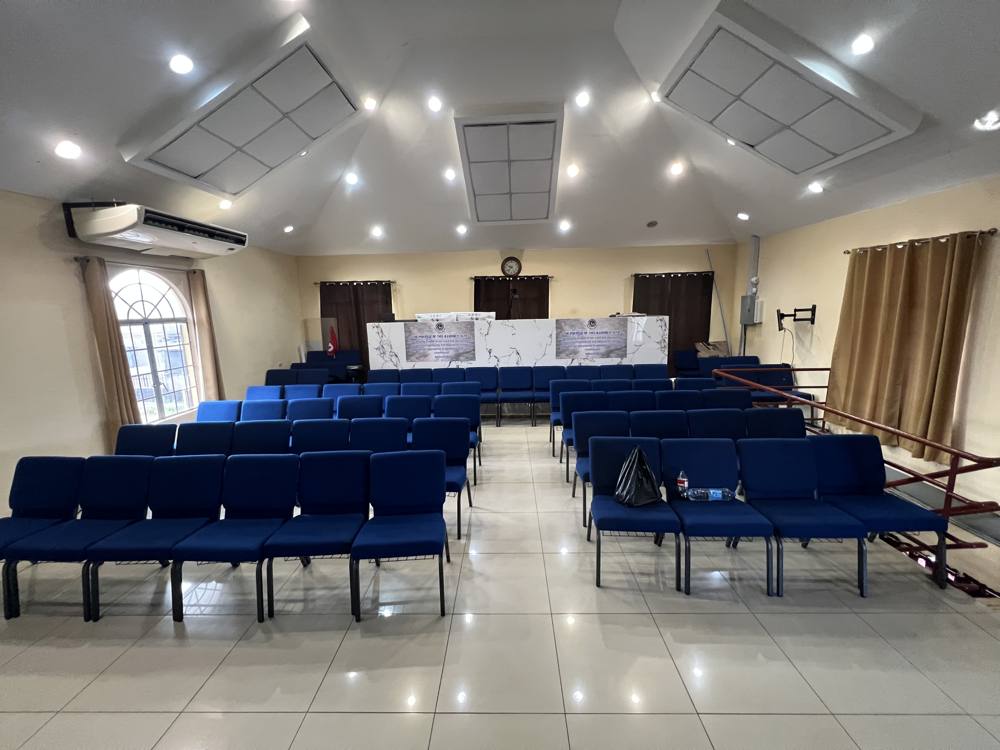 Rows of upholstered church chairs