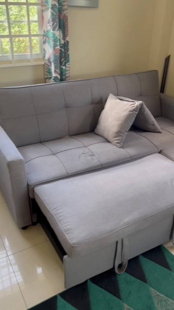 Grey sofa bed after a deep clean