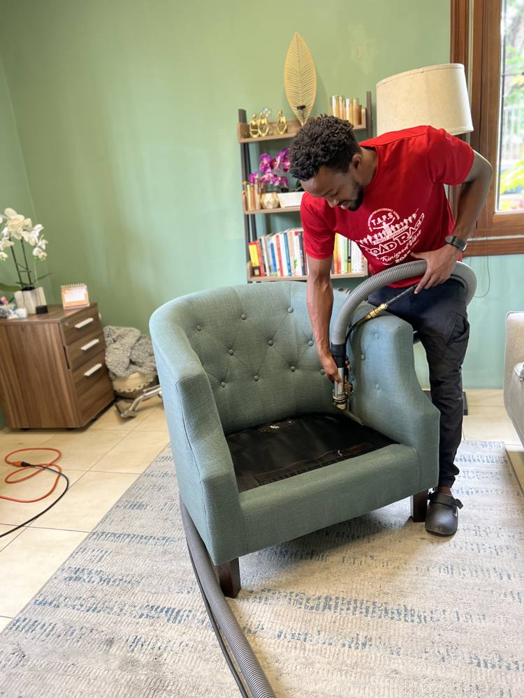 Accent chair being cleaned